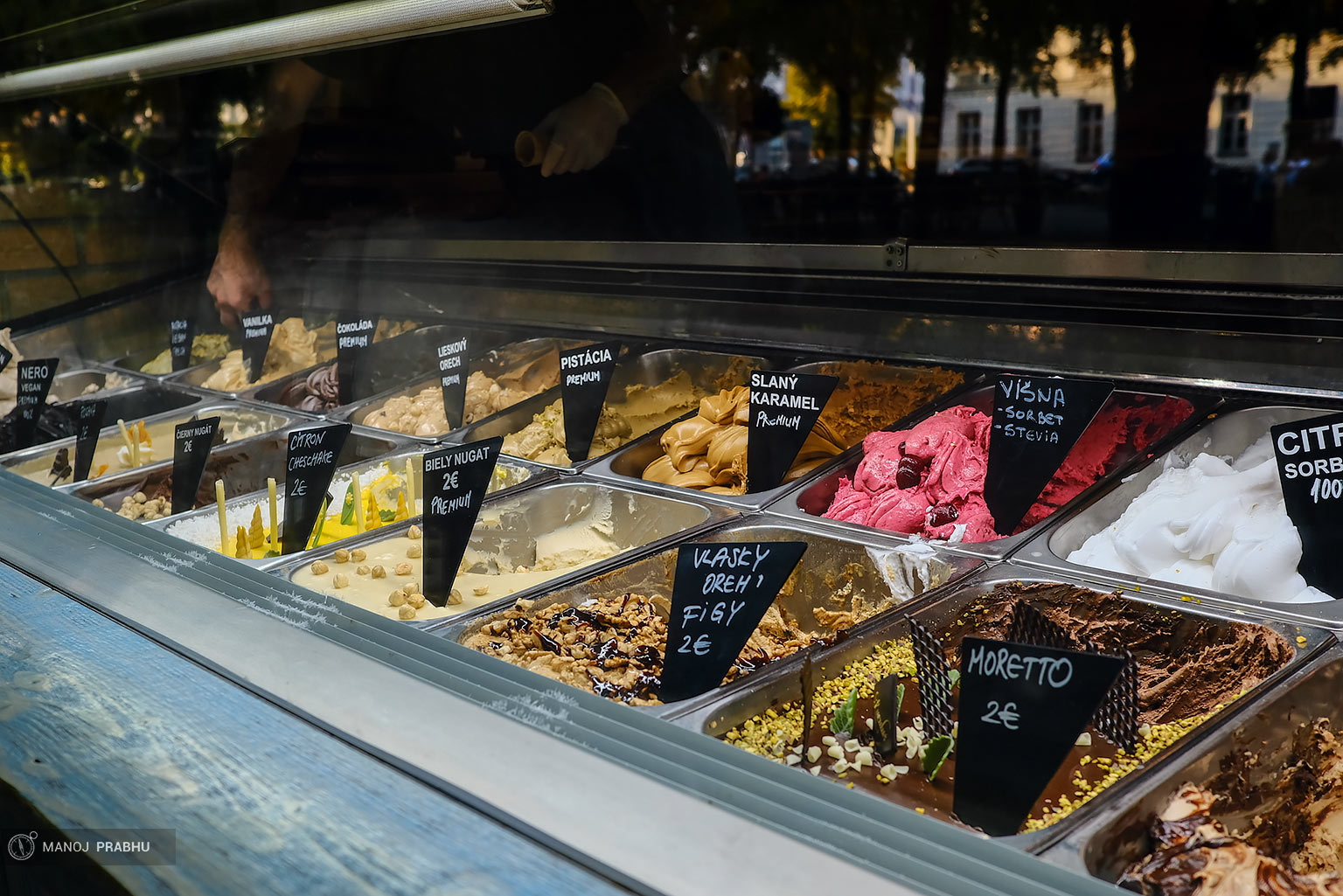 Tubs of ice-cream containers at an ice-cream shop. (Shot on Fujifilm X-Pro2 using Kodak Ektar 100 film simulation recipe)