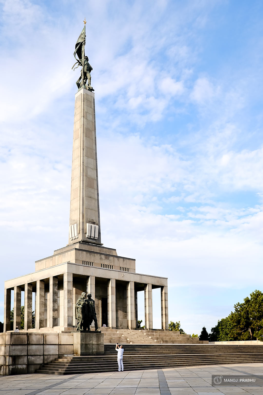 A man photographing a statue. (Shot on Fujifilm X-Pro2 using Kodak Ektar 100 film simulation recipe)